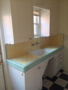 kitchen with yellow tile and pale teal trim